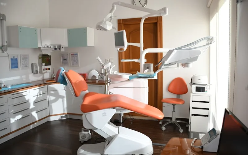 Modern dental operatory with a patient chair and equipment
